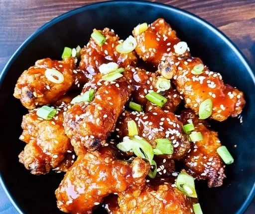 Deliciously crispy Air Fryer Korean Fried Chicken served with dipping sauce