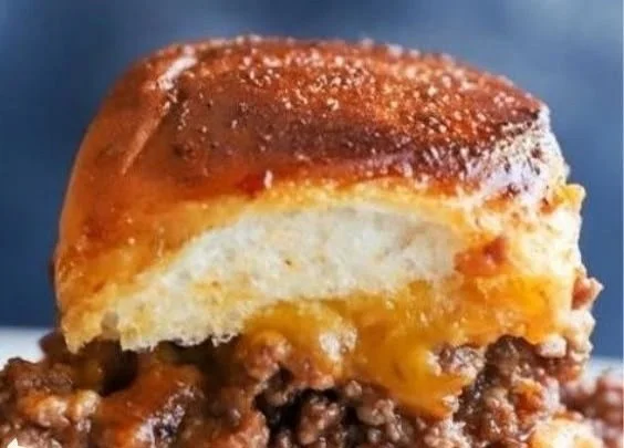 Pull Apart Cheeseburger Sliders served on a platter at a party