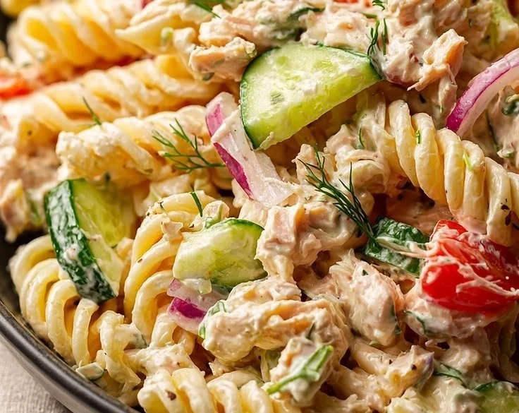 Zesty tuna pasta salad with colorful vegetables and dressing