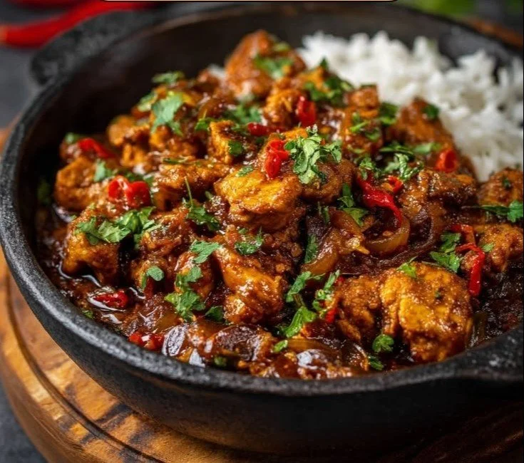 Delicious Chicken Bhuna showcasing spices and tender chicken pieces in a vibrant sauce.