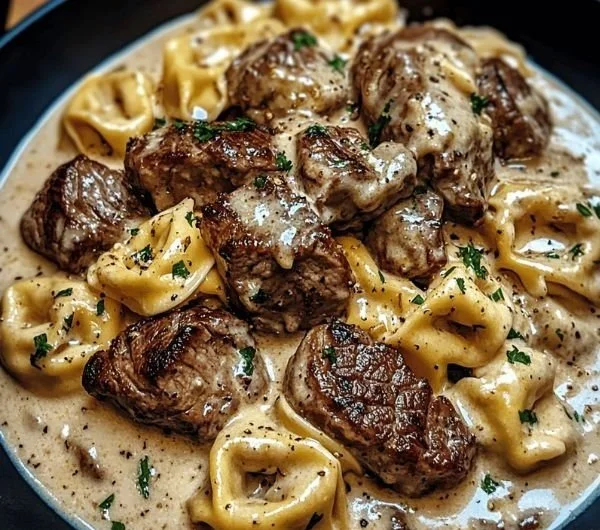 Delicious cracked garlic steak tortellini served in creamy sauce