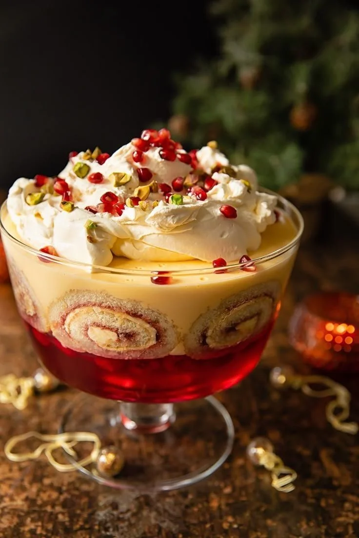 Delicious easy English trifle with layers of fruit and custard in a glass dish.