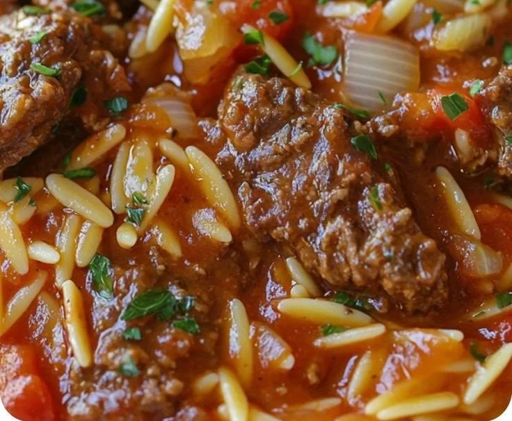 A delicious bowl of Greek Manestra made with orzo pasta and fresh vegetables.