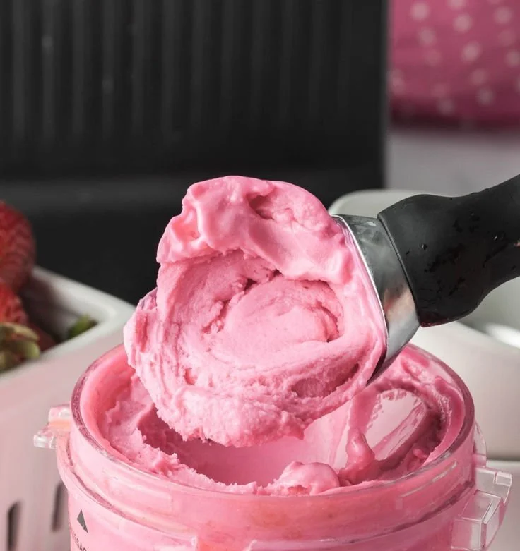 Ninja Creami Starbucks Pink Drink topped with berries and coconut flakes