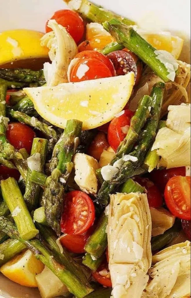 A vibrant Asparagus Cherry Tomato Salad garnished with fresh herbs.