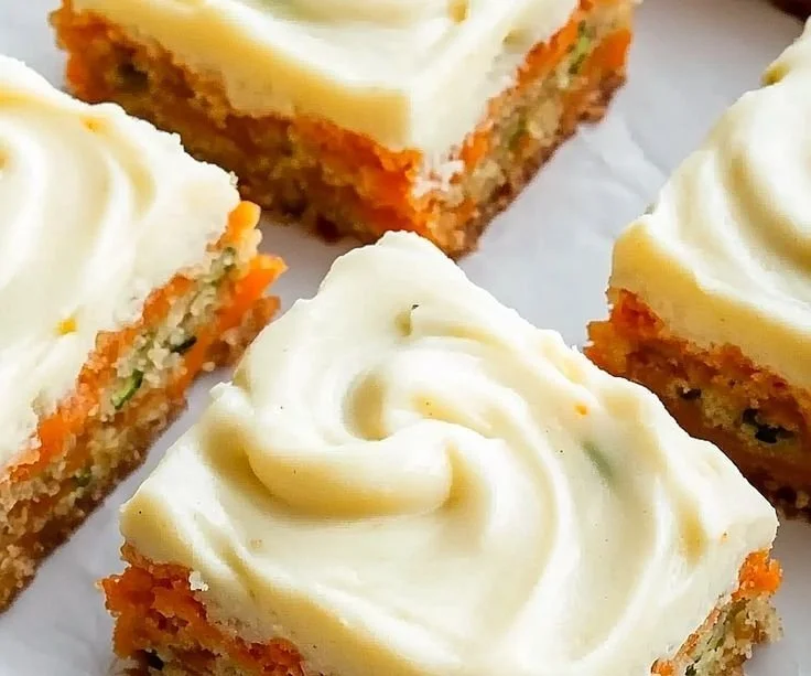 Delicious Carrot Zucchini Bars with Lemon Frosting on a plate