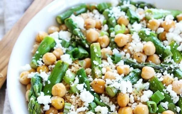 Quinoa salad with asparagus and chickpeas served in a bowl