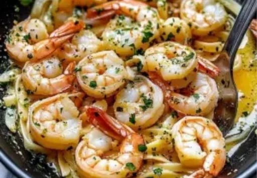 Delicious shrimp scampi served elegantly on a plate with garlic and parsley.