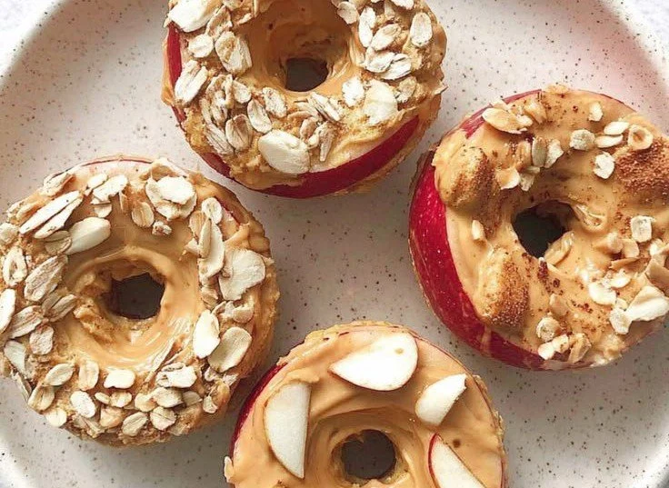 Delicious Donut Apples topped with creamy peanut butter for a tasty snack.