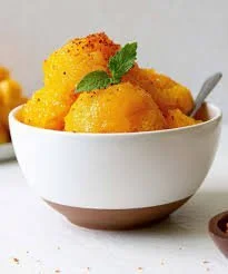 Homemade Mango Sorbet served in a bowl with mango slices