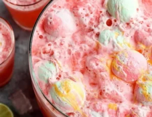Refreshing Sherbet Punch in a glass, perfect for parties and gatherings.