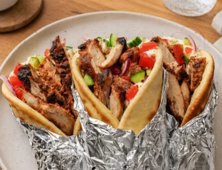 Delicious Greek Chicken Gyros with chicken, vegetables and tzatziki sauce