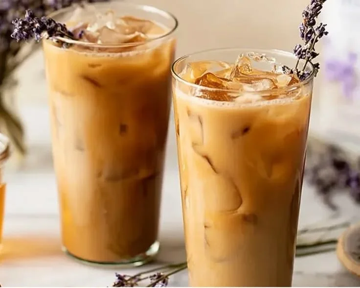 Iced Honey Lavender Latte topped with a sprinkle of lavender flowers