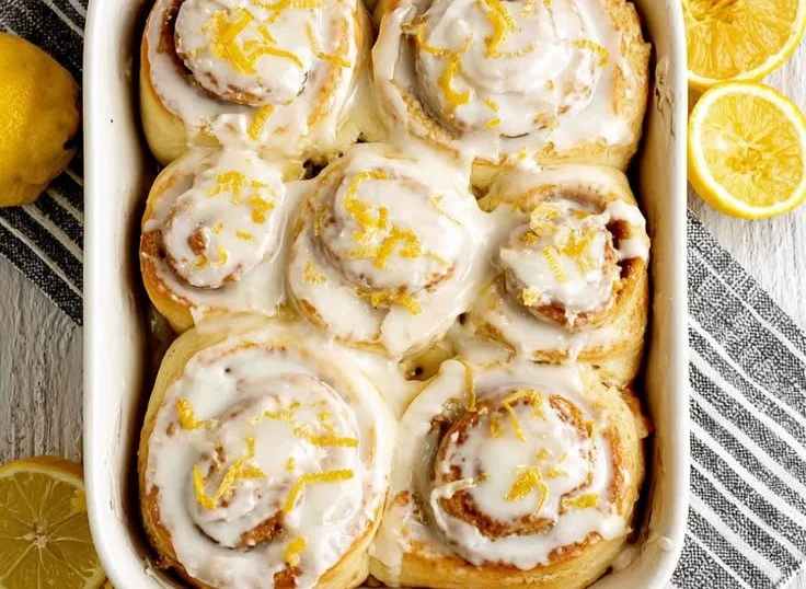 Freshly baked lemon rolls drizzled with lemon glaze