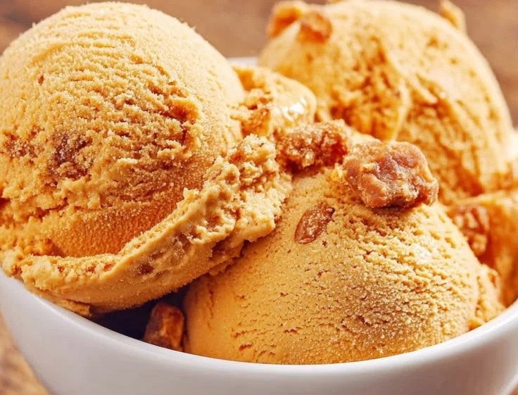 Delicious pumpkin ice cream served in a bowl with a sprinkle of cinnamon