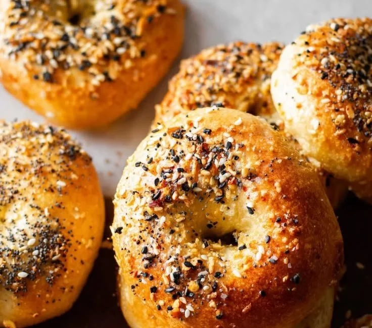 Freshly made 3 ingredient air fryer bagels on a cooling rack.