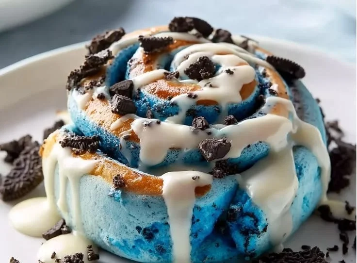 Delicious Cookie Monster cinnamon rolls with colorful frosting and chocolate chips