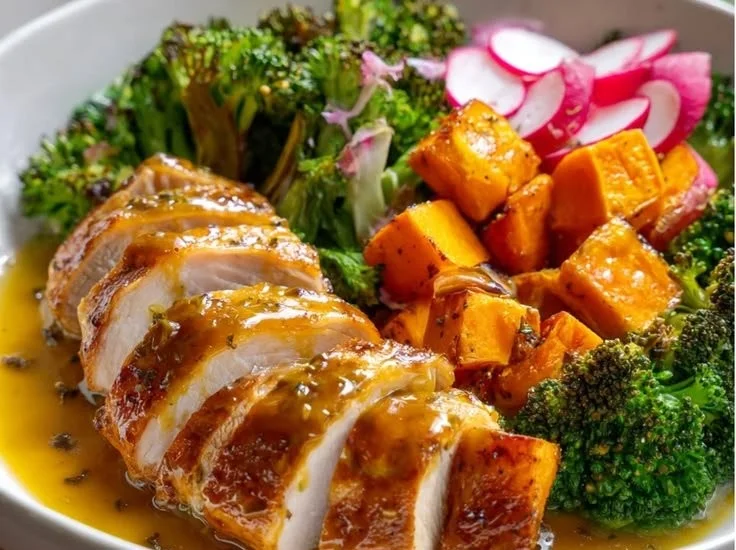 Maple Dijon Chicken Sweet Potato Bowl topped with fresh greens and herbs