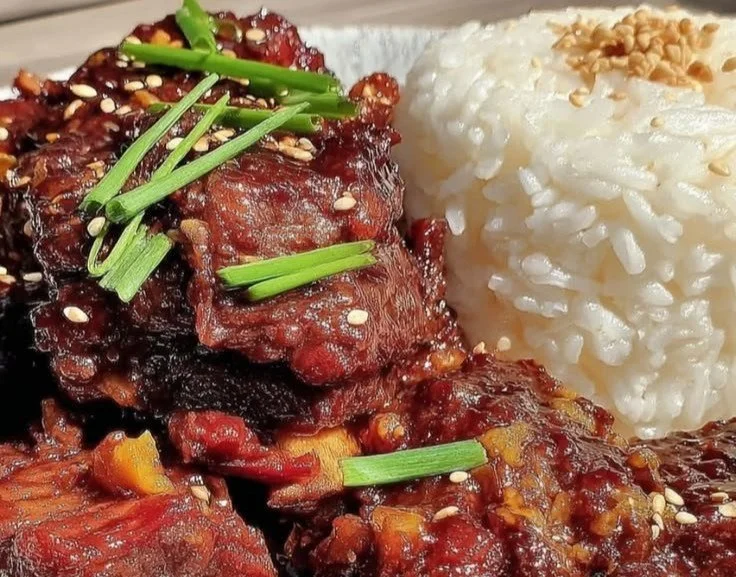 Delicious Slow Cooker Korean BBQ Beef Short Ribs served with rice and vegetables.