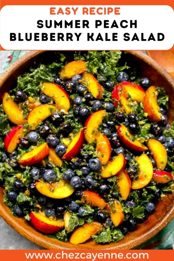 Fresh summer peach blueberry kale salad in a bowl with vibrant colors.