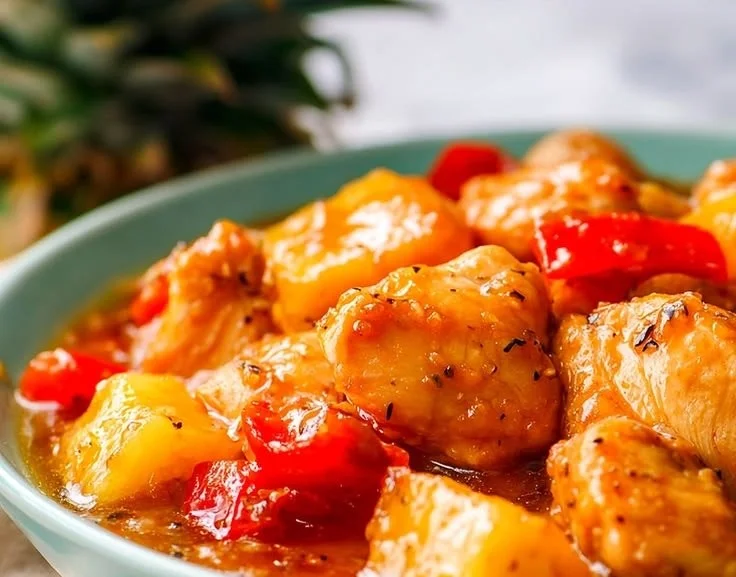 Delicious Tender Crockpot Hawaiian Chicken served with pineapples and bell peppers