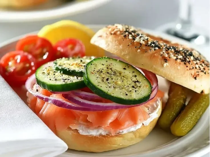 A beautifully arranged smoked salmon bagel board with fresh toppings.