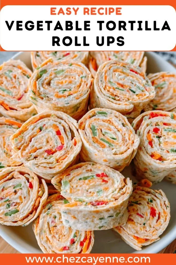 Colorful vegetable tortilla roll ups on a serving platter.