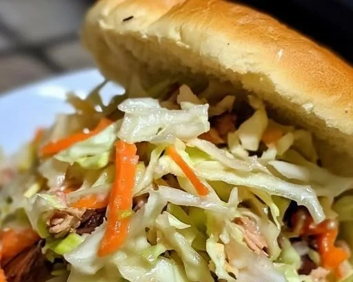 Bowl of vinegar coleslaw with fresh cabbage and carrots