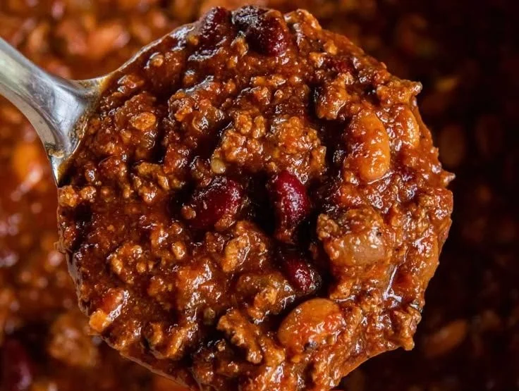 A delicious bowl of the best easy chili recipe topped with fresh herbs.