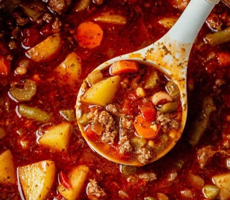 A bowl of delicious Cowboy Soup with beans, vegetables, and spices.