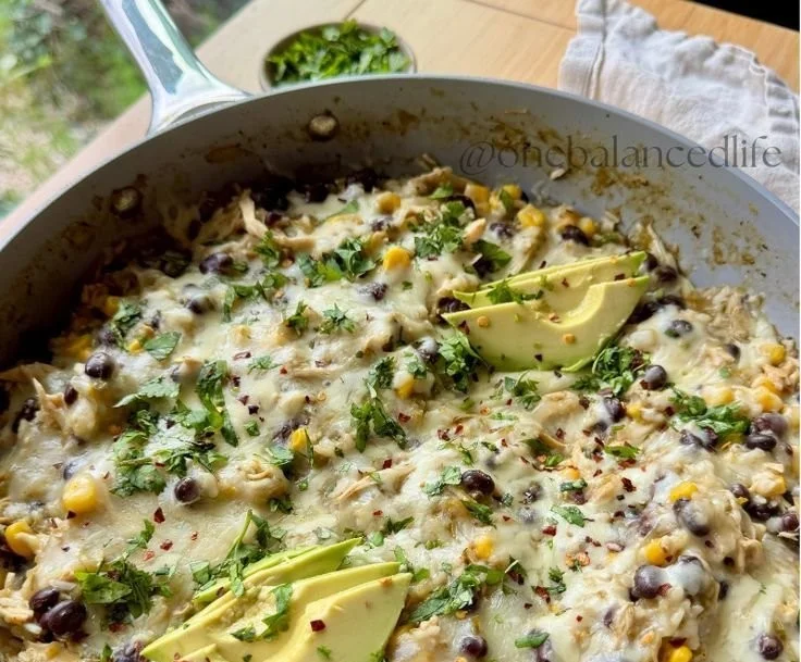 Salsa Verde Chicken & Rice Skillet dish garnished with fresh herbs