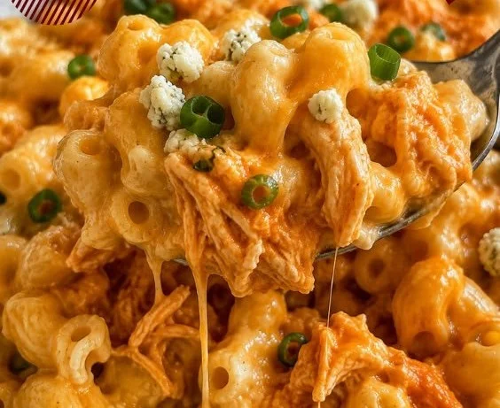 Delicious Buffalo Chicken Mac and Cheese topped with flavorful buffalo sauce and cheese