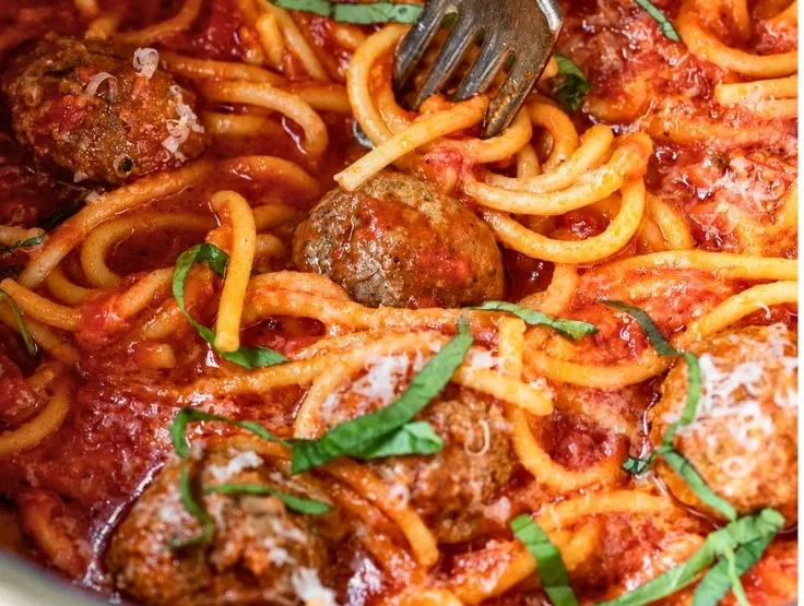 Instant Pot spaghetti and meatballs served in a bowl with marinara sauce.