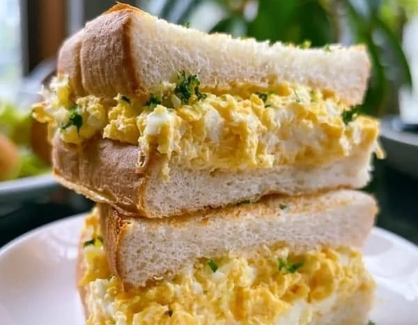 Authentic Japanese egg sandwich (Tamago Sando) on a plate.