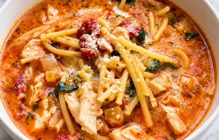 Creamy Tuscan Chicken Soup with spinach served in a bowl