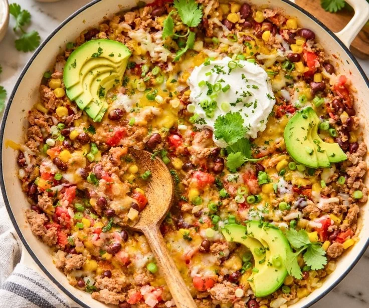 Easy ground turkey taco skillet served in a pan with toppings