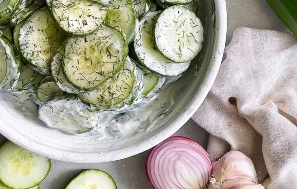 Delicious creamy cucumber salad served in a bowl for summer BBQ