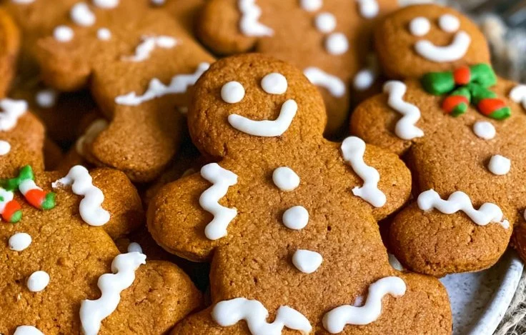 Decorated gingerbread cookies for Christmas with colorful icing and festive designs.