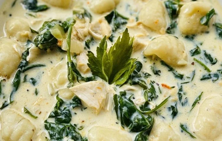 Bowl of homemade Olive Garden Chicken Gnocchi Soup, a creamy and hearty dish.