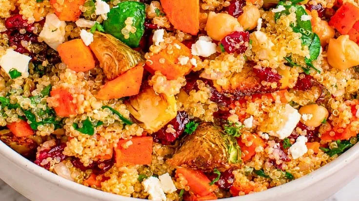 Healthy fall quinoa salad with roasted vegetables and chickpeas in a bowl.