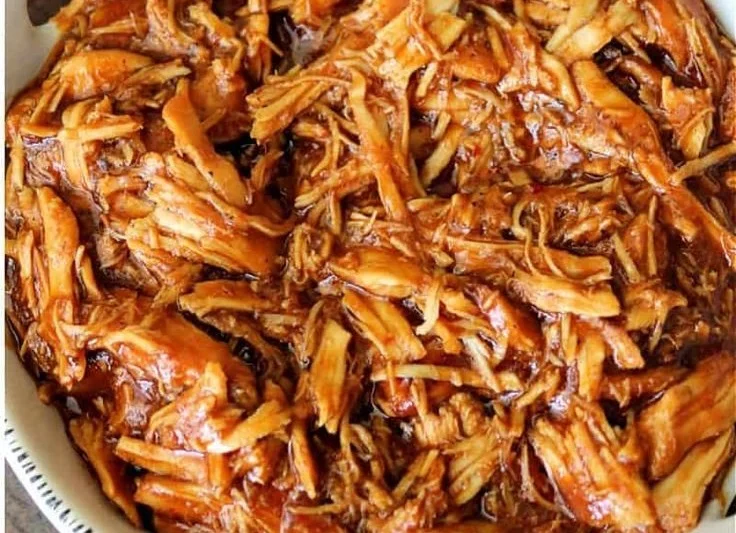 Delicious Crockpot BBQ Chicken served on a plate with sides